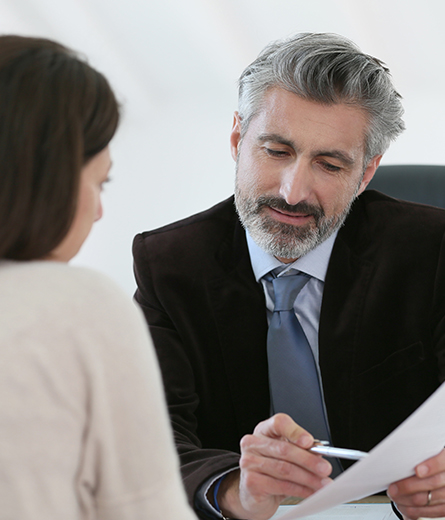 Lawyer Discussing a Document With a Client